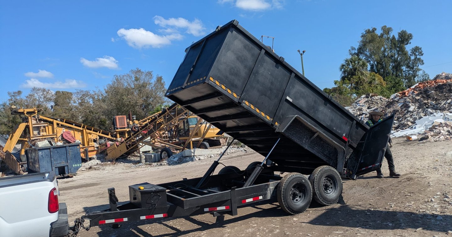 Experienced trailer specialist securing cargo straps before a local hauling trip