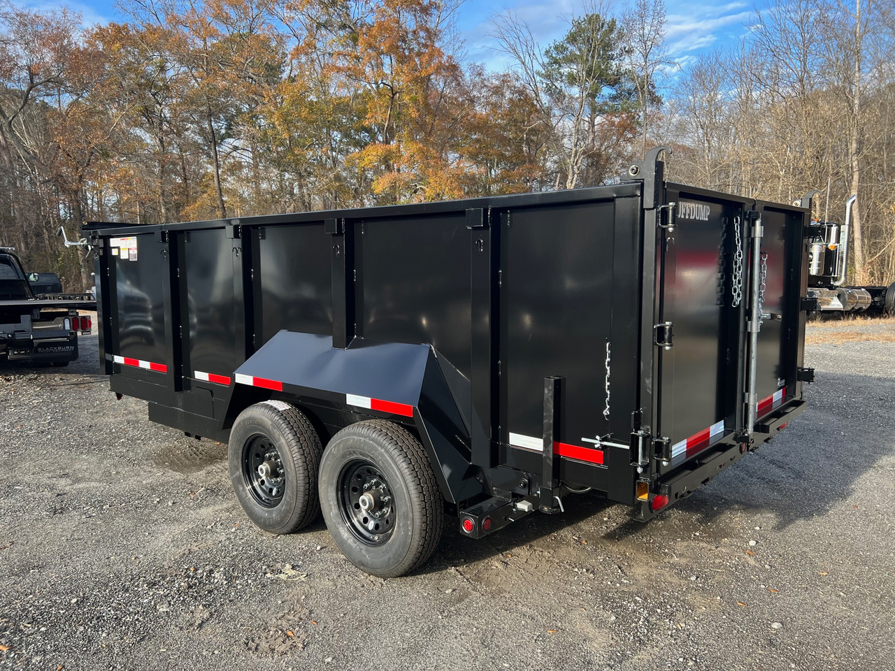 Customer loading supplies into a trailer at a Hendersonville driveway before a weekend project