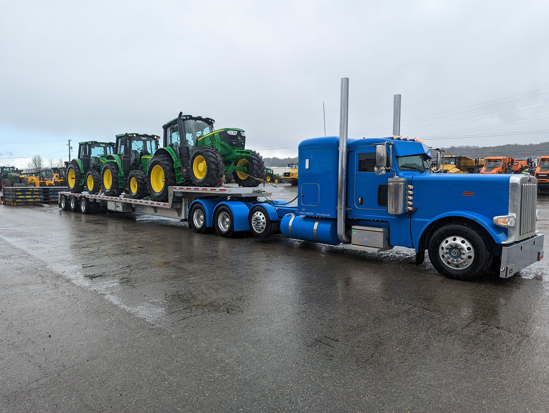 Skilled trailer rental professional inspecting hitch connection and load setup before departure
